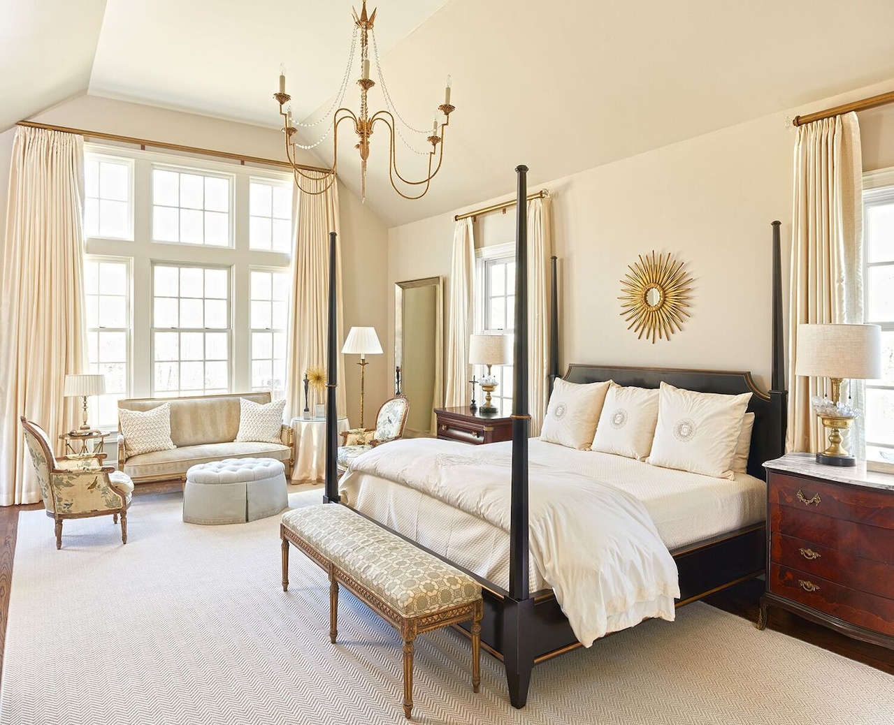 Antiques fill the master bedroom, reminiscent of an upscale hotel suite. The designer painted walls a tinted version of Benjamin Moore’s Revere Pewter. Antiques fill the master bedroom, reminiscent of an upscale hotel suite. The designer painted walls a tinted version of Benjamin Moore’s Revere Pewter.