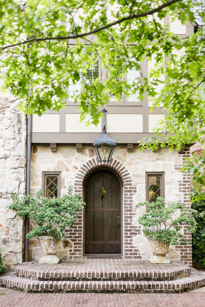 "A brick coining detail was added to the arched front door," says John of one way that they merged the new landscape architecture into the existing home. "A brick coining detail was added to the arched front door," says John of one way that they merged the new landscape architecture into the existing home.