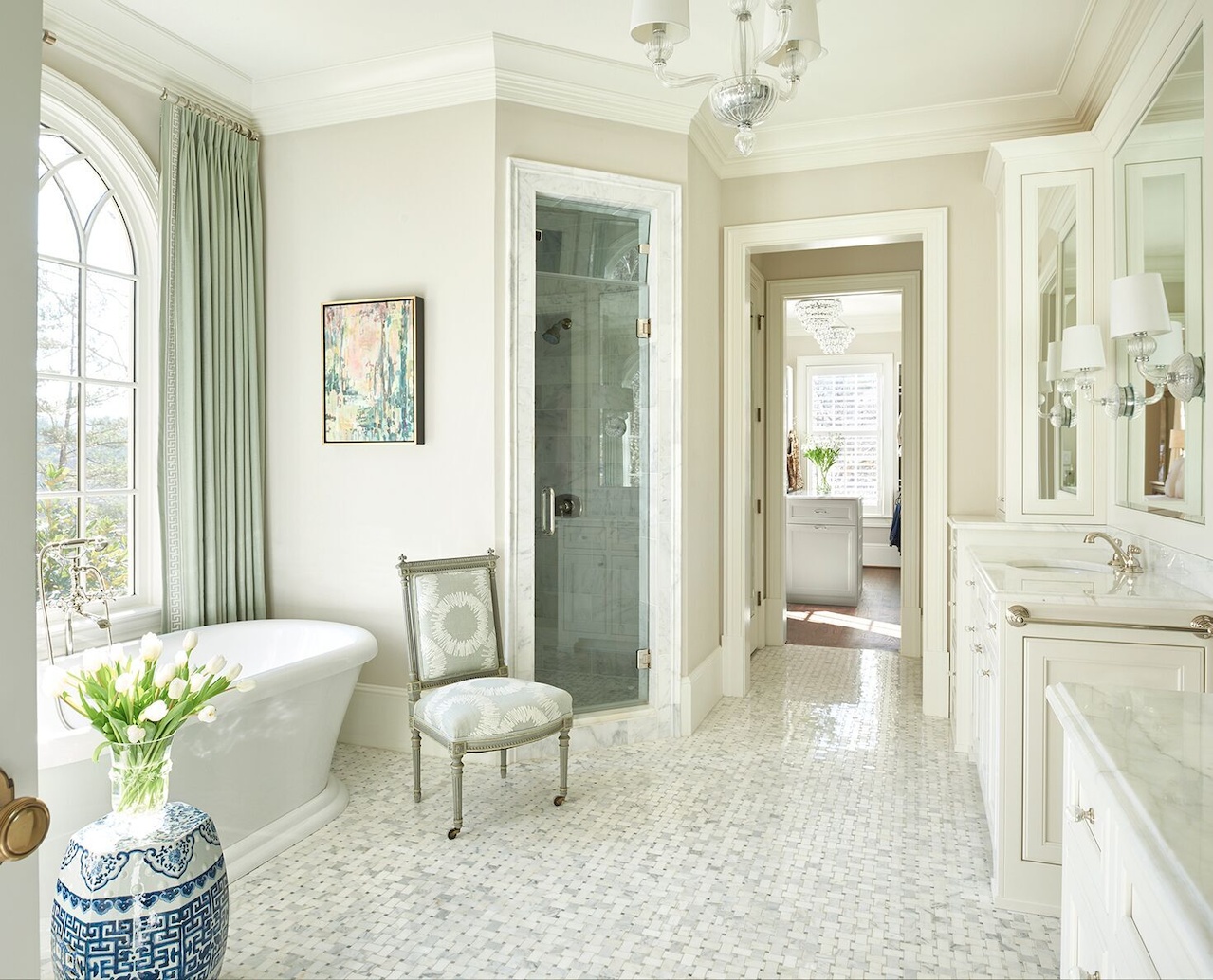 Luxurious window treatments—made from Duralee fabrics—soften the free-standing tub. Soft shades of green elevate the bathroom from a typical all-white scenario. Luxurious window treatments—made from Duralee fabrics—soften the free-standing tub. Soft shades of green elevate the bathroom from a typical all-white scenario.