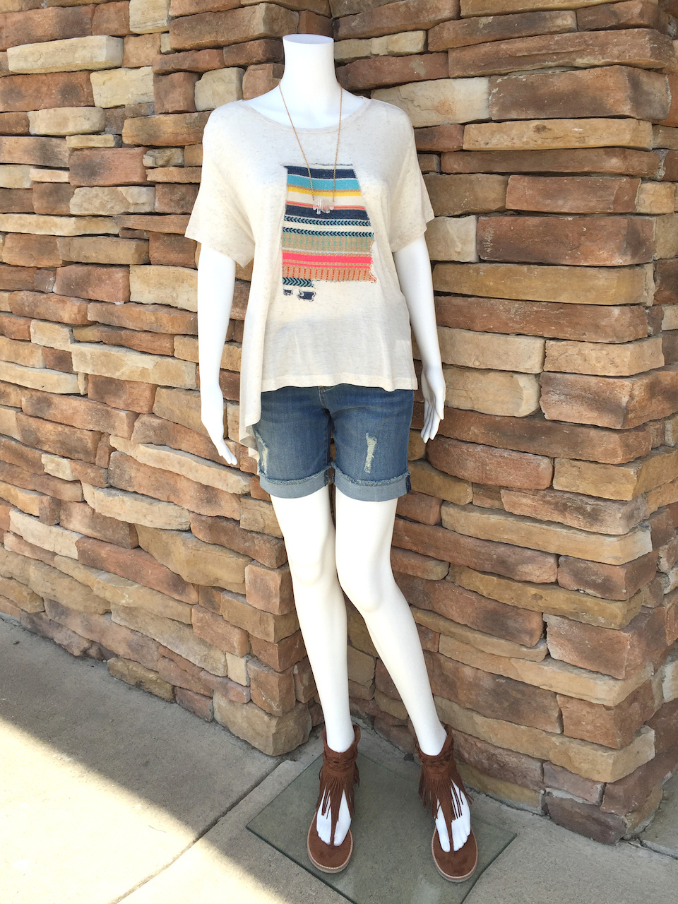 From Rogers Trading Company: Judith March flowy cream tee with embroidered Alabama state, $49.99; rolled cuff medium wash boyfriend short, $68.99 From Rogers Trading Company: Judith March flowy cream tee with embroidered Alabama state, $49.99; rolled cuff medium wash boyfriend short, $68.99
