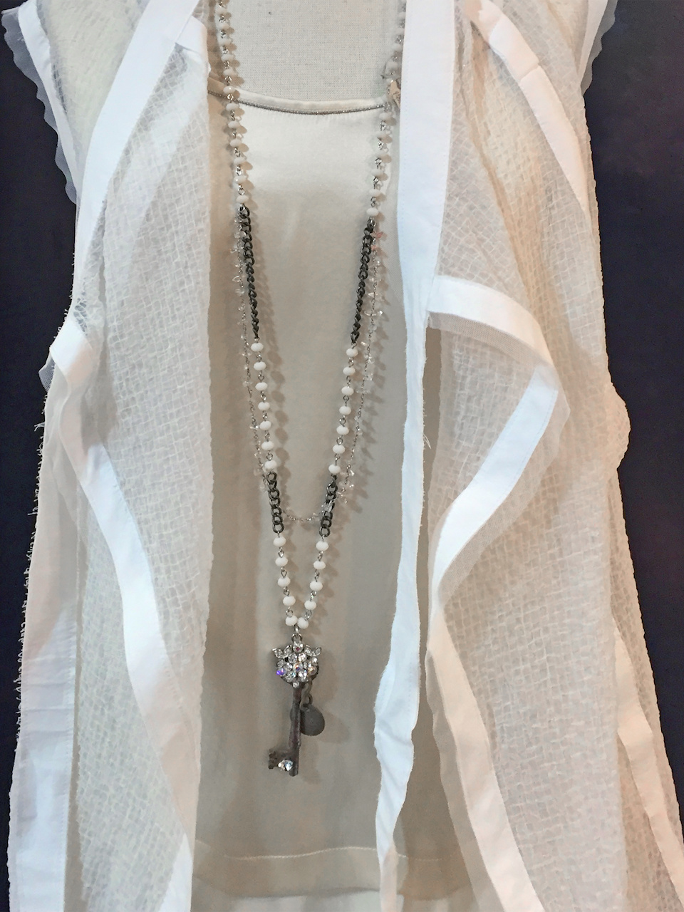 From Betsy Prince: vintage hotel key with rhinestones & rose quartz on glass bead chain, $275 From Betsy Prince: vintage hotel key with rhinestones & rose quartz on glass bead chain, $275
