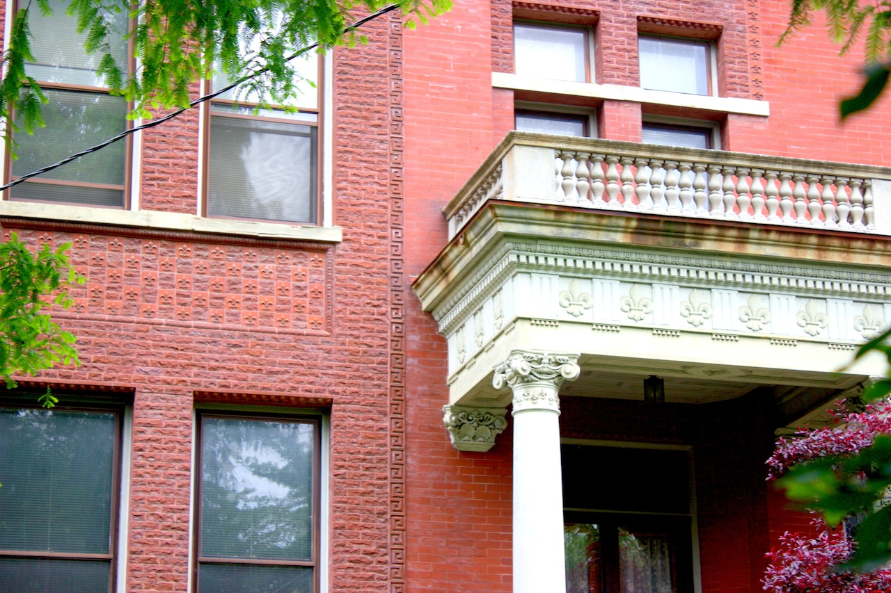 Look closely or you'll miss the details - see the tiny fleur de lis dotting the red brick below the windows? There are over 200 fleur de lis decorating this home on Third Street! walking tour Old Louisville