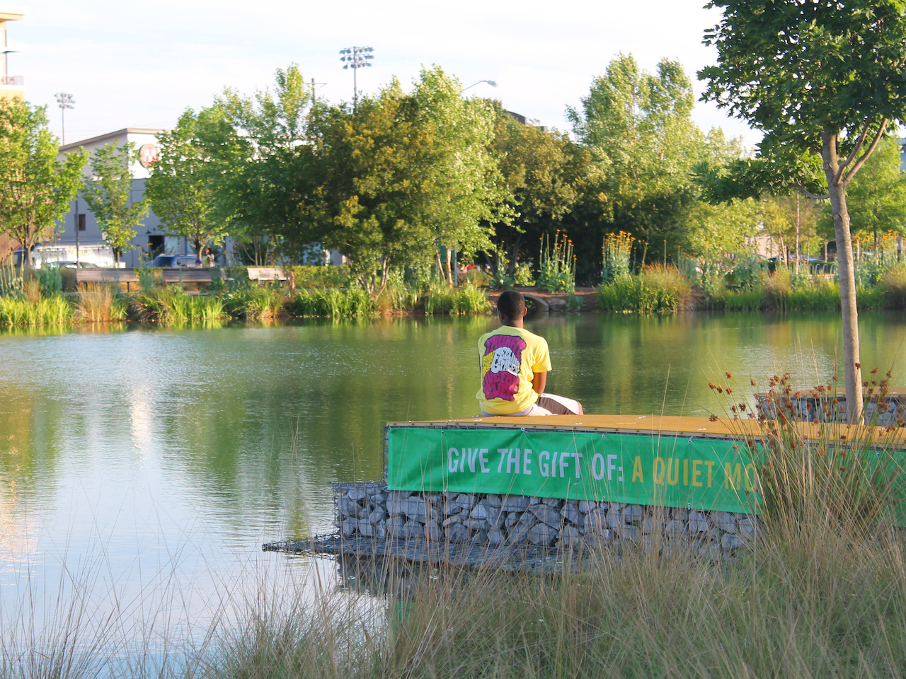 A boy enjoys a quiet moment at Railroad Park. A boy enjoys a quiet moment at Railroad Park.