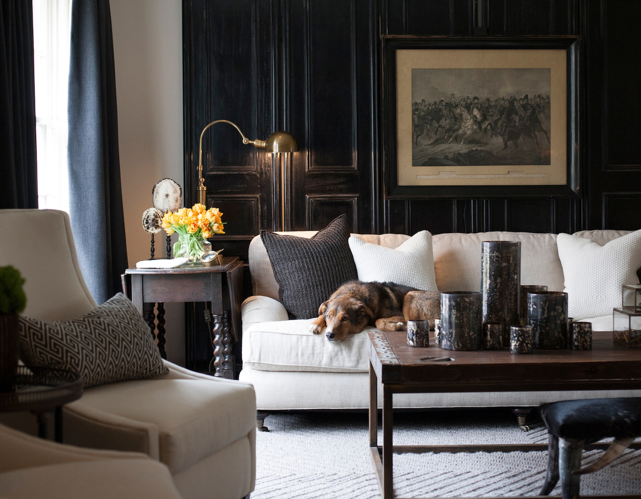 In Sean's own house, he added dark antique doors against a white wall for a dramatic effect. In Sean's own house, he added dark antique doors against a white wall for depth.