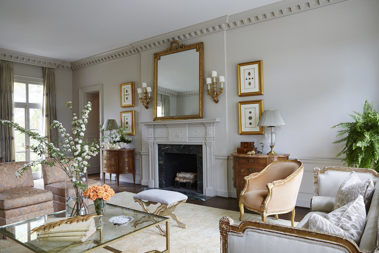 "I chose a grayed taupe color with pops of salmon for the color palette in the Decorators' Showhouse living room," says Libby. "I loved incorporating the old with the new in this pretty living room!" "I chose a grayed taupe color with pops of salmon for the color palette in the Decorators' Showhouse living room," says Libby. "I loved incorporating the old with the new in this pretty living room!"