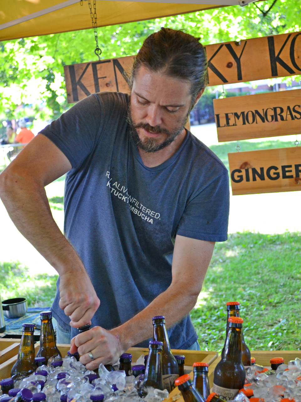 He's putting in the pouring spouts for the testers here Good eats at the Louisville Farmers Markets