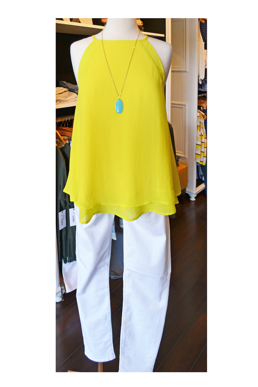 This color looks great on everyone, promise! Bright yellow high necked tank top with white jeans is a great summer outfit.