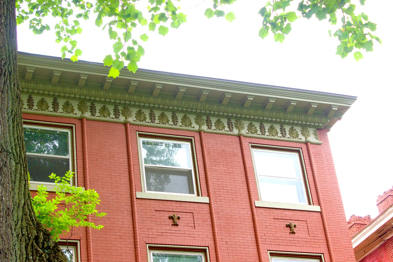 The original owner of this home was a tobacco magnate and had the three primary tobacco leaves grown in Kentucky carved into the trim of his Third Street home. walking old louisville