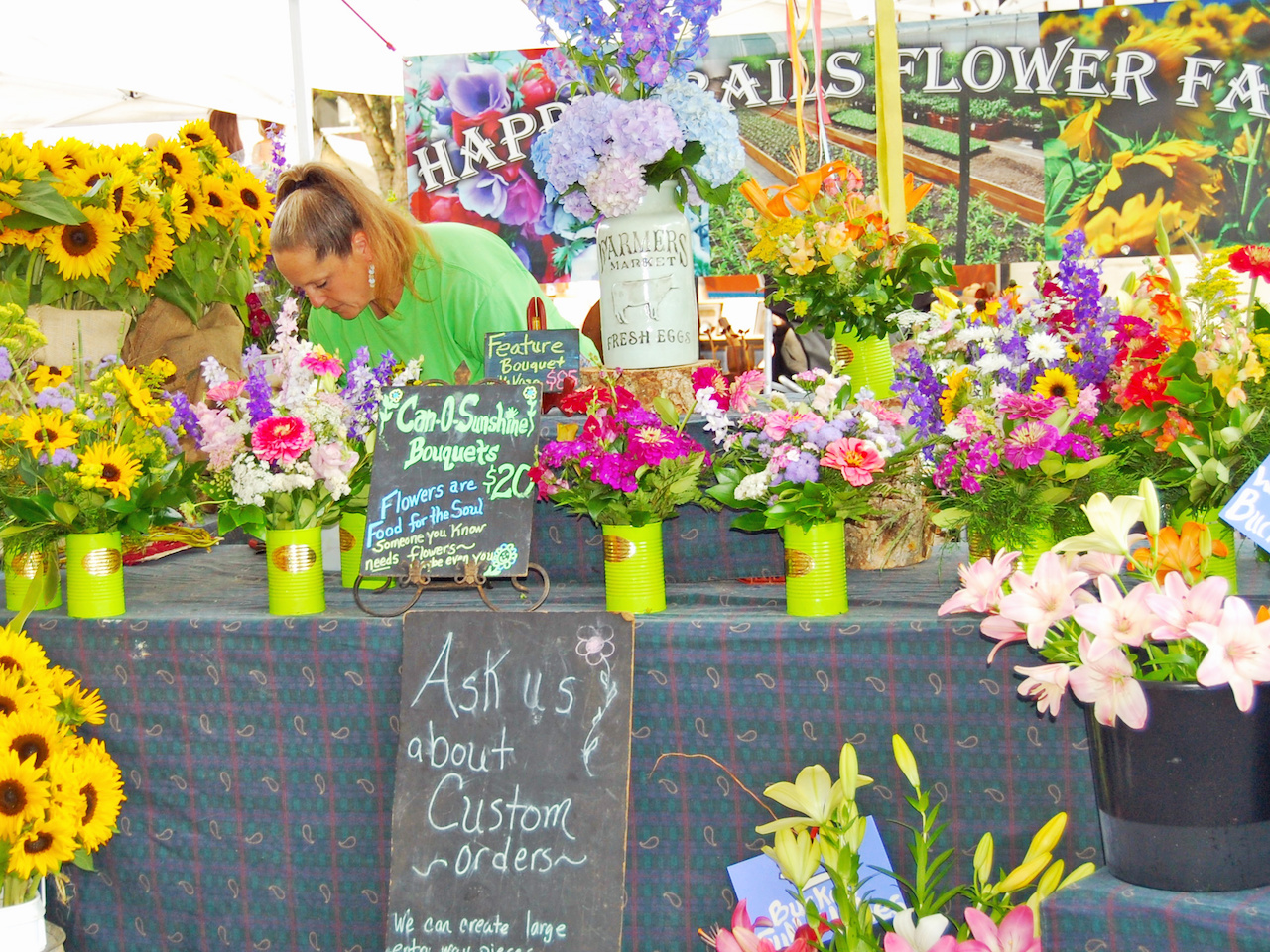 The Happy Trails Flower Farm tent at the Market at Pepper Place offer bouquets to brighten up your weekend! The Happy Trails Flower Farm tent at the Market at Pepper Place offer bouquets to brighten up your weekend!
