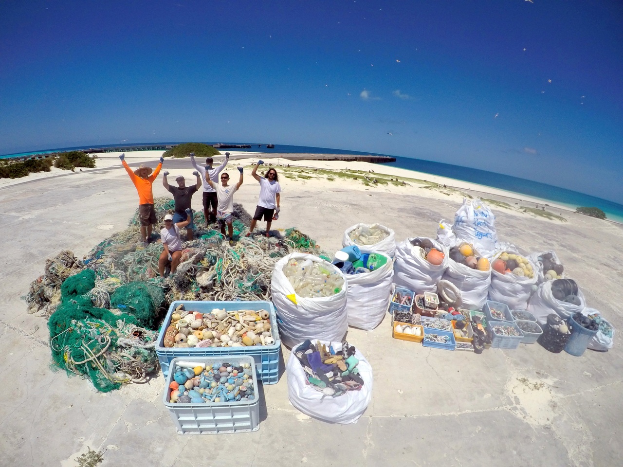 The Marine Debris team closes out removal efforts at Midway Atoll, where a total of 12,030 lbs of derelict fishing nets and 8,000 lbs of plastics were removed from the shorelines. For the next phase of the 2016 Mission the team will be moving onboard the NOAA Ship Hi'ialakai to continue marine debris removal at the other islands and atolls of the Papahanaumokuakea Marine National Monument. Photo: NOAA Fisheries