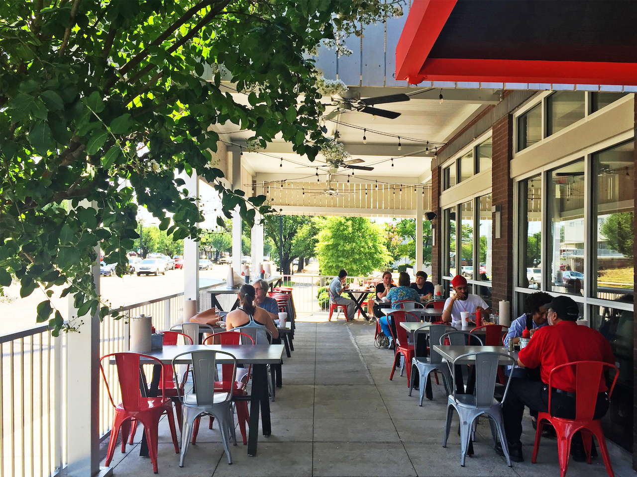 Hattie B's outside patio continues its comfortable and shared feeling. Hattie B's outside patio continues its comfortable and shared feeling.