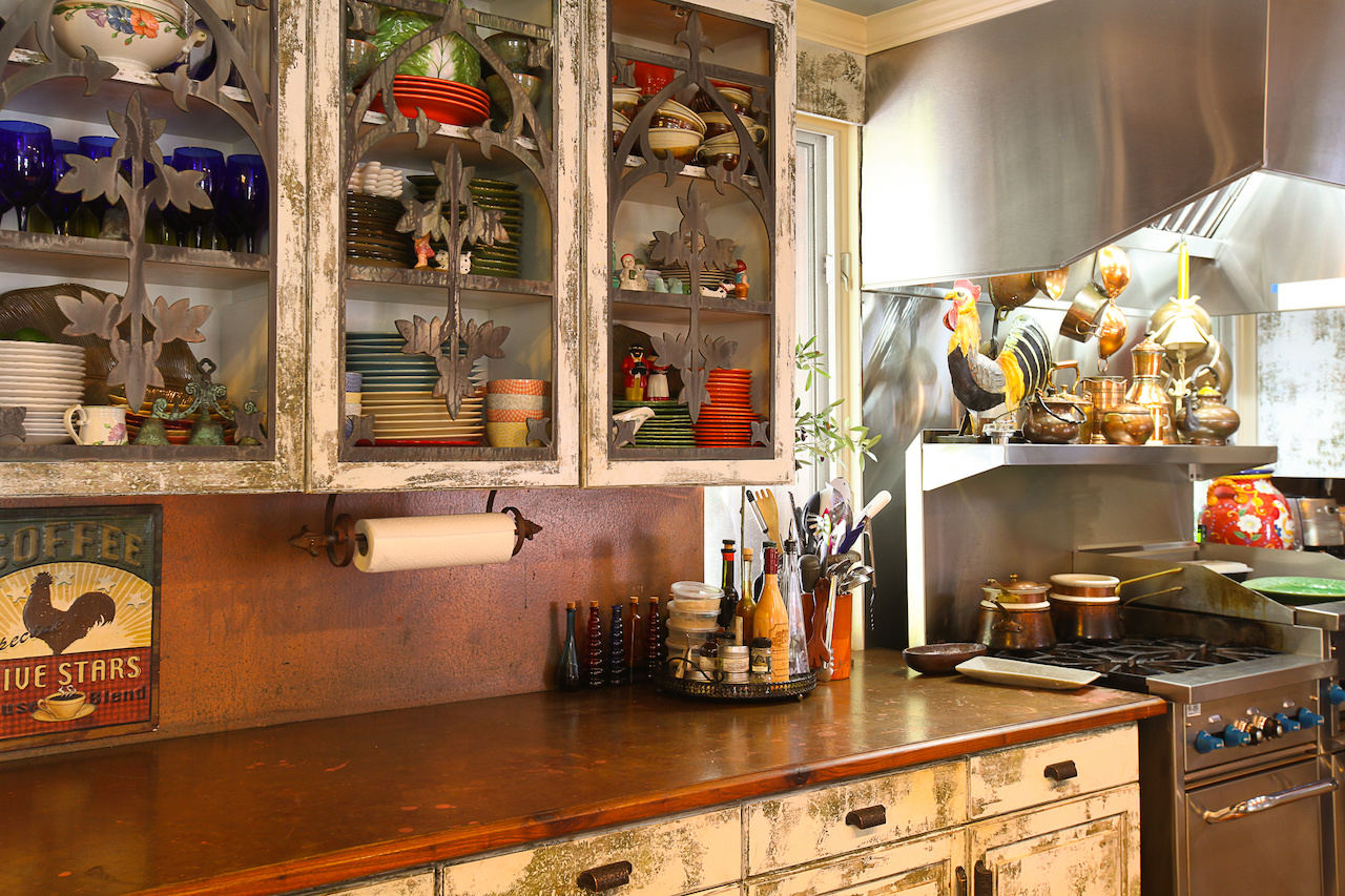 Colorful plates peek out from the open cabinets.