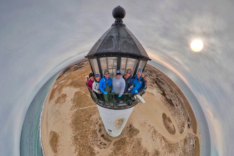 A "tinyworld" photo of the seal sampling team at the top of the lighthouse