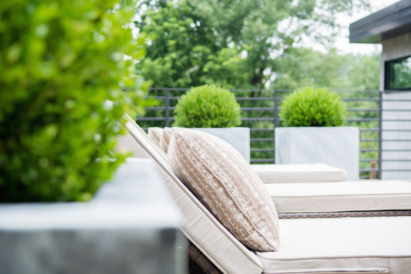 relaxing amongst the topiaries From a Fallaway Lot to a Dream House
