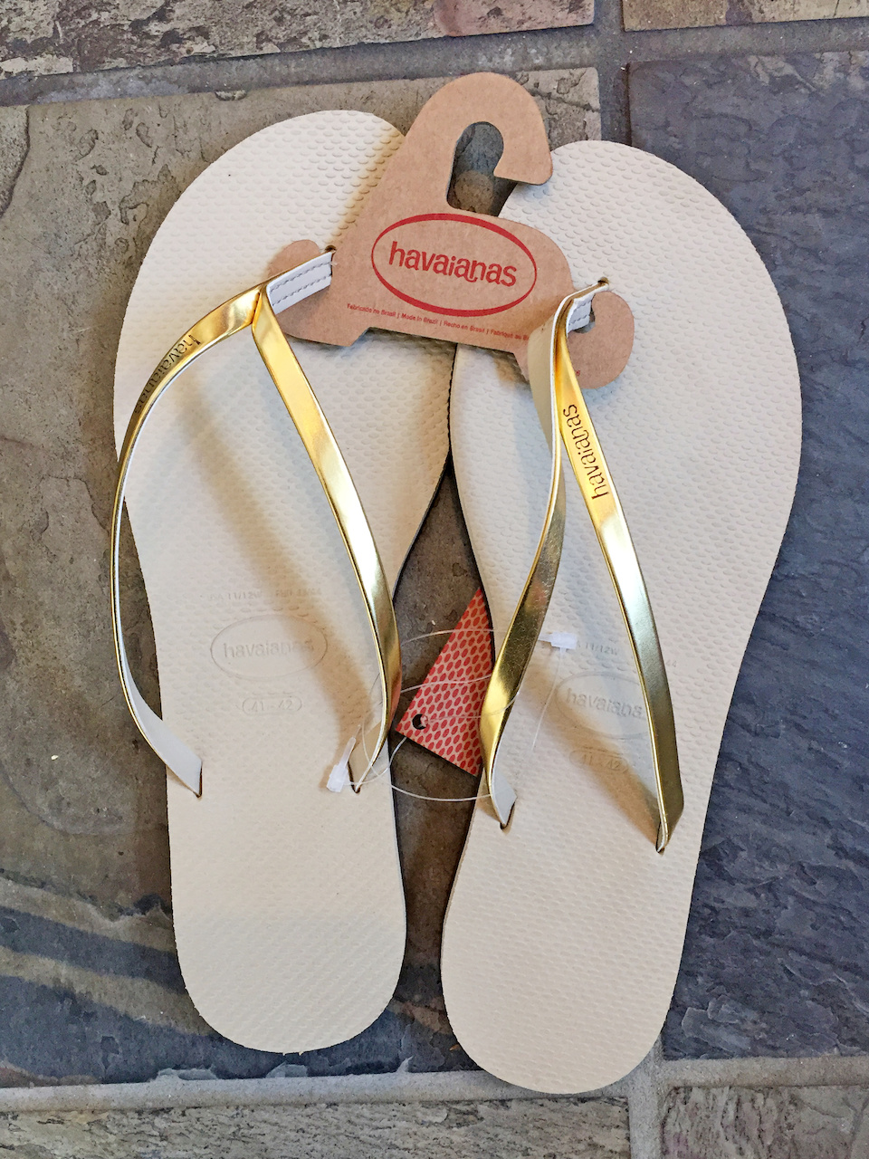 Gold metallic looks great against bronzed skin. Havaianas flip flops -- July FINDS