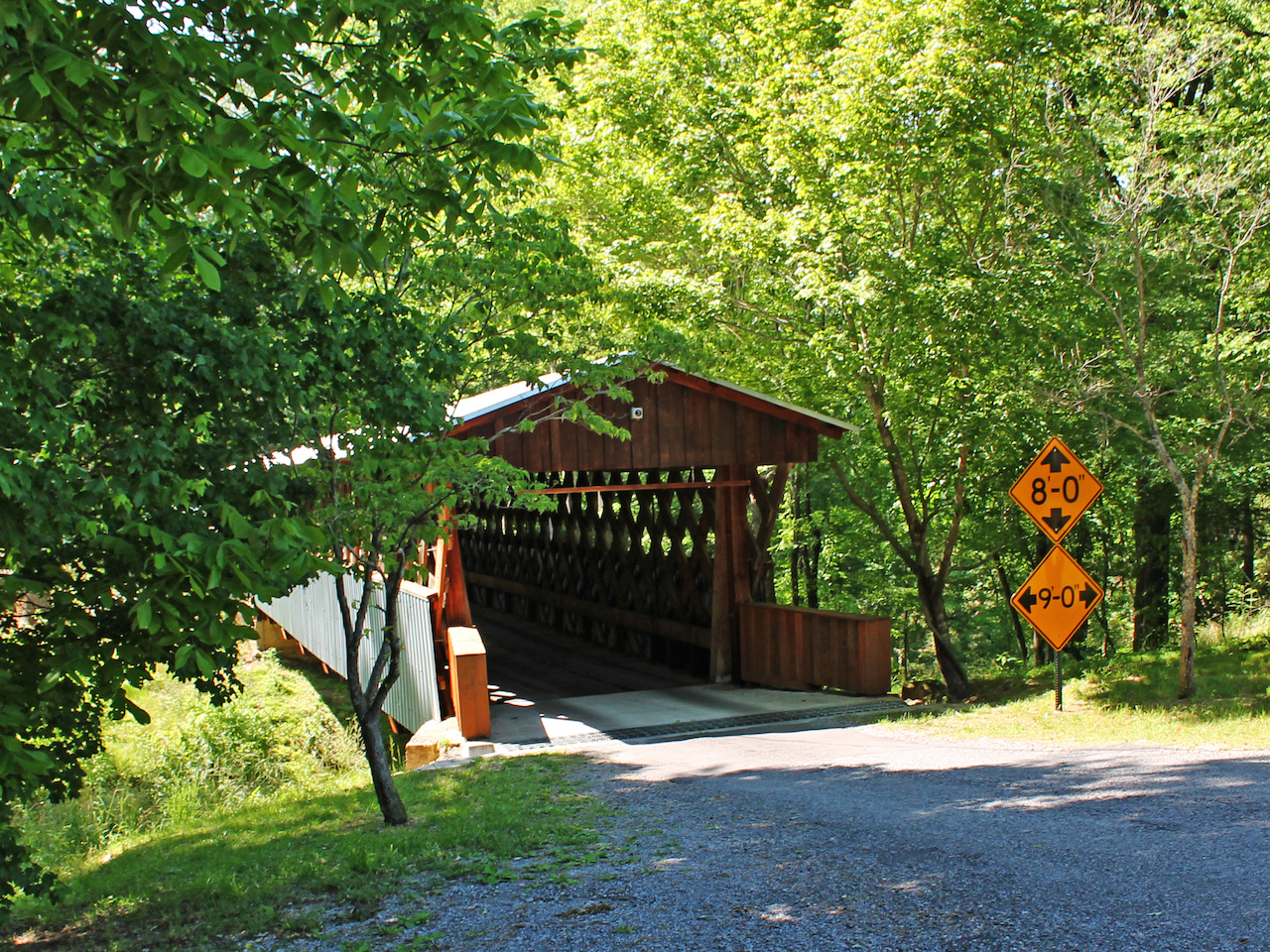 Old Easley Bridge is surrounded by lush greenery on Easley Bridge Road. Old Easley Bridge is surrounded by lush greenery on Easley Bridge Road.