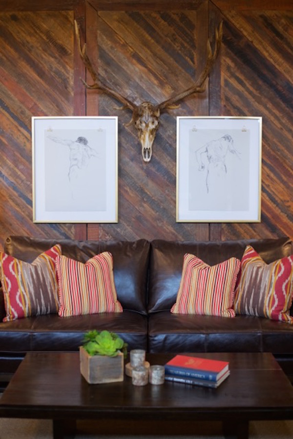 remember to center on the focal furniture point Mix up your mediums and subjects when thinking about where to hang your art.