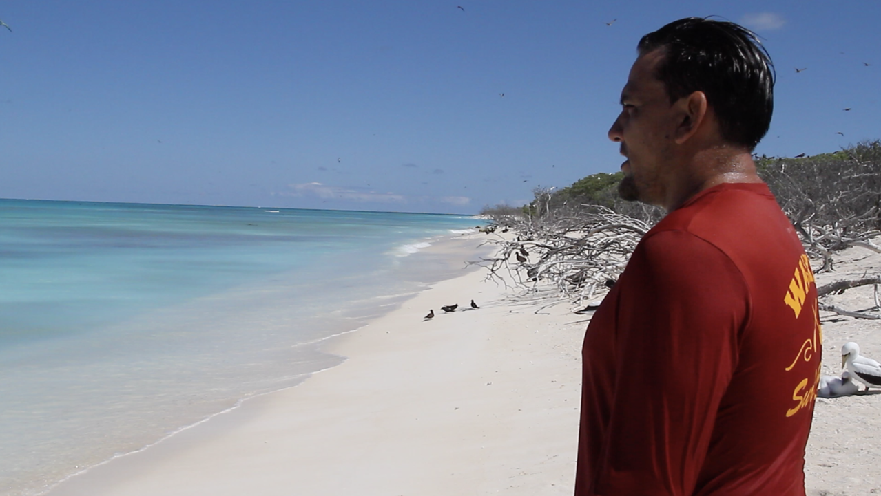 Keoni_Wilhelm stands on beach at Lisianski