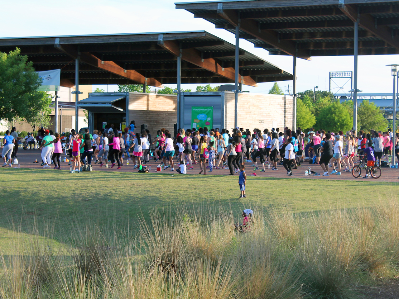 A Zumba class takes place on the shady pavilion at Railroad Park. A Zumba class takes place on the shady pavilion at Railroad Park.