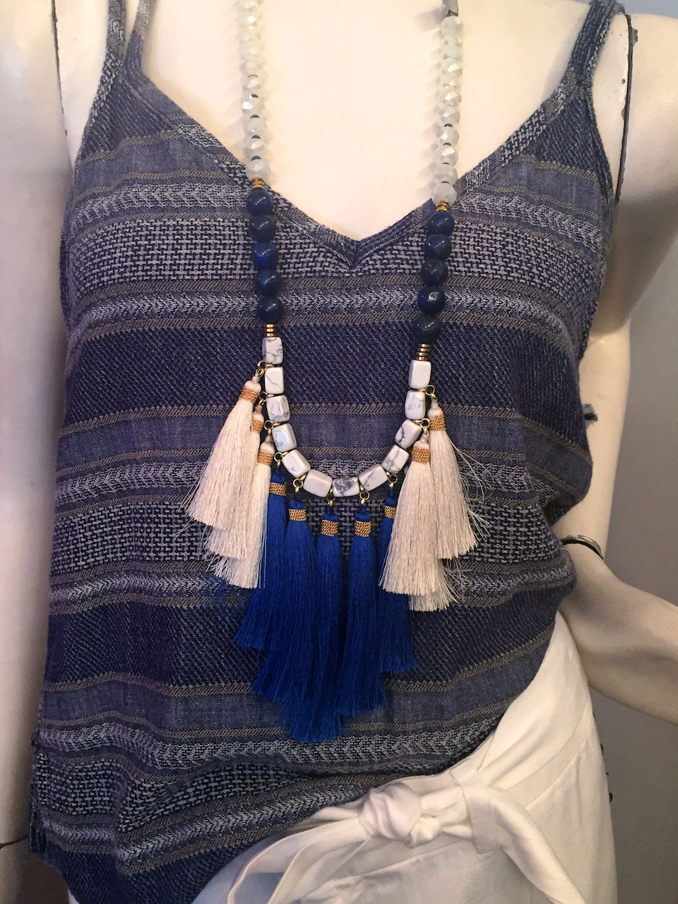 From Theadora Abbeyluxe: Blue and white tassel necklace, $88 From Theadora Abbeyluxe: Blue and white tassel necklace, $88
