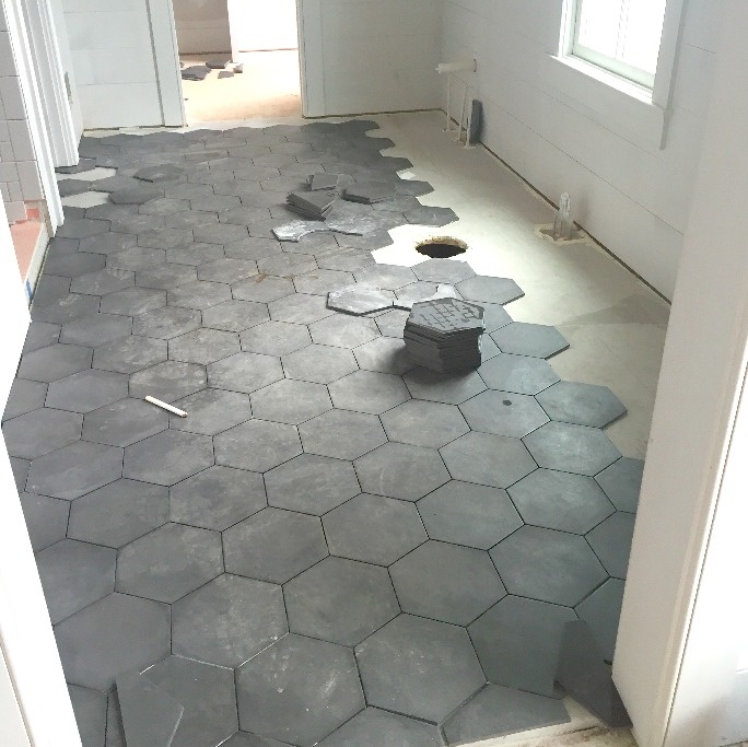 Matte tile here and matte white subway tile carriage house homearama slate floor.jpg