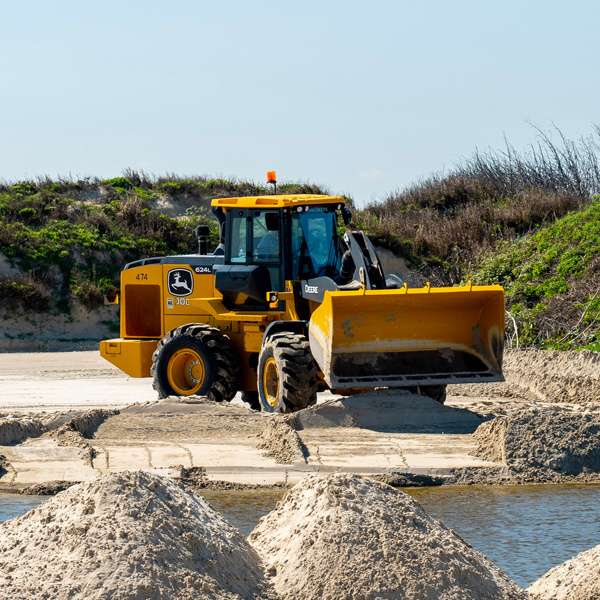 Yellow construction vehicle near water