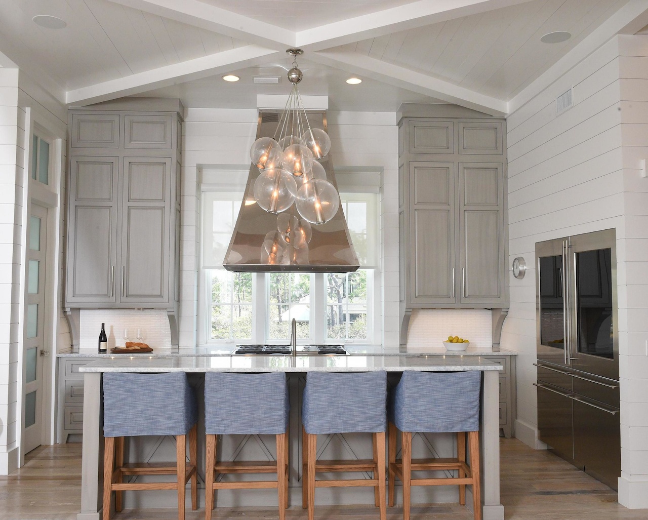 Barstools from Lee Industries are covered in soft blue slipcovers, which are easy to wash — a bonus when grandchildren have come to visit! Barstools from Lee Industries are covered in soft blue slipcovers, which are easy to wash — a bonus when grandchildren have come to visit!