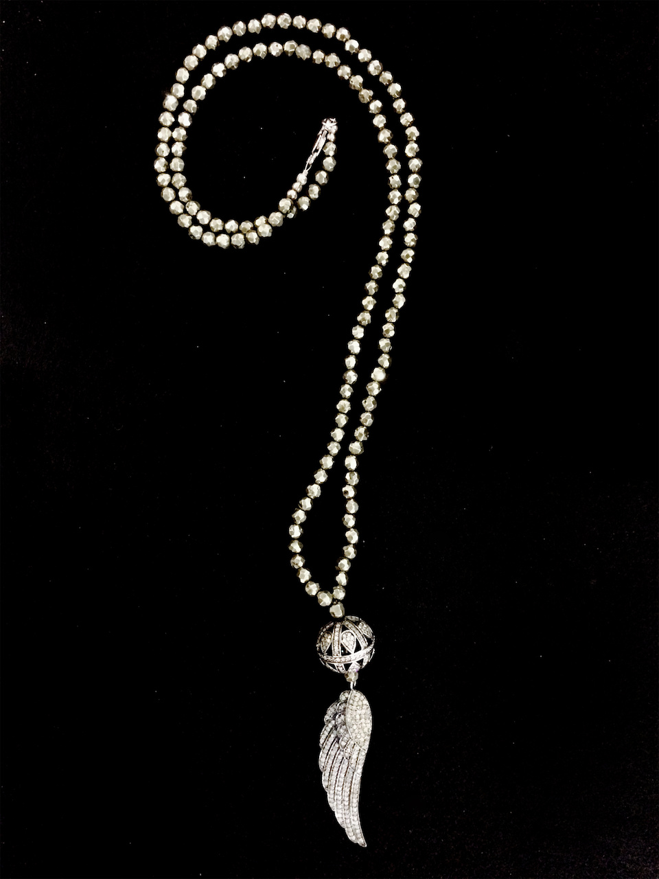 A cool way to dress up a look. Feather diamond necklace StyleBlueprint Atlanta