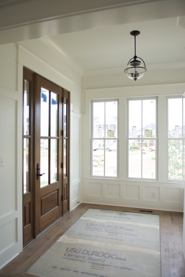 The door is left in natural wood Behind the Scenes: Designing a Homearama house from start to finish