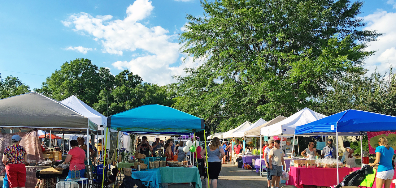 Colorful tents and shoppers enjoy a day under blue skies at the West Homewood Farmers Market. Colorful tents and shoppers enjoy a day under blue skies at the West Homewood Farmers Market.