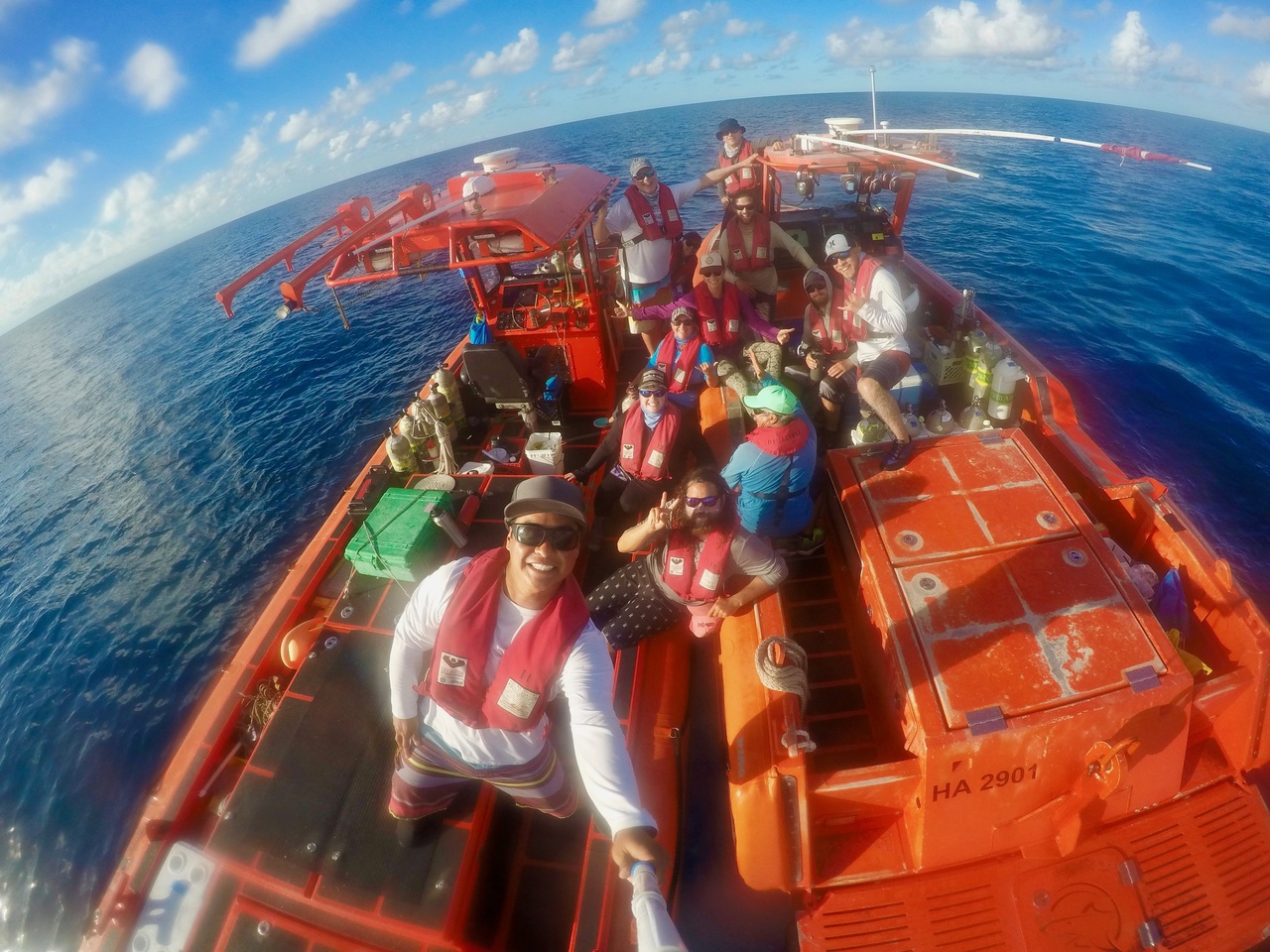 The two survey teams meet up to celebrate another successful RAMP mission while waiting to get picked up by the NOAA Ship<i> Rainier</i>. Well done, team! <i>Photo: NOAA Fisheries/James Morioka. </i>