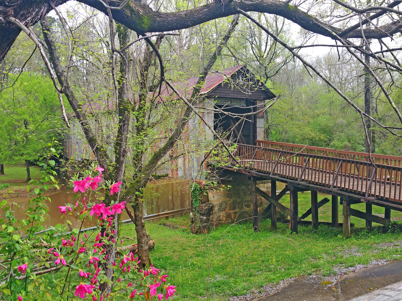 The Kymulga Bridge is at Kymulga Grist Mill & Park in Childersburg, Alabama. The Kymulga Bridge is at Kymulga Grist Mill & Park in Childersburg, Alabama.
