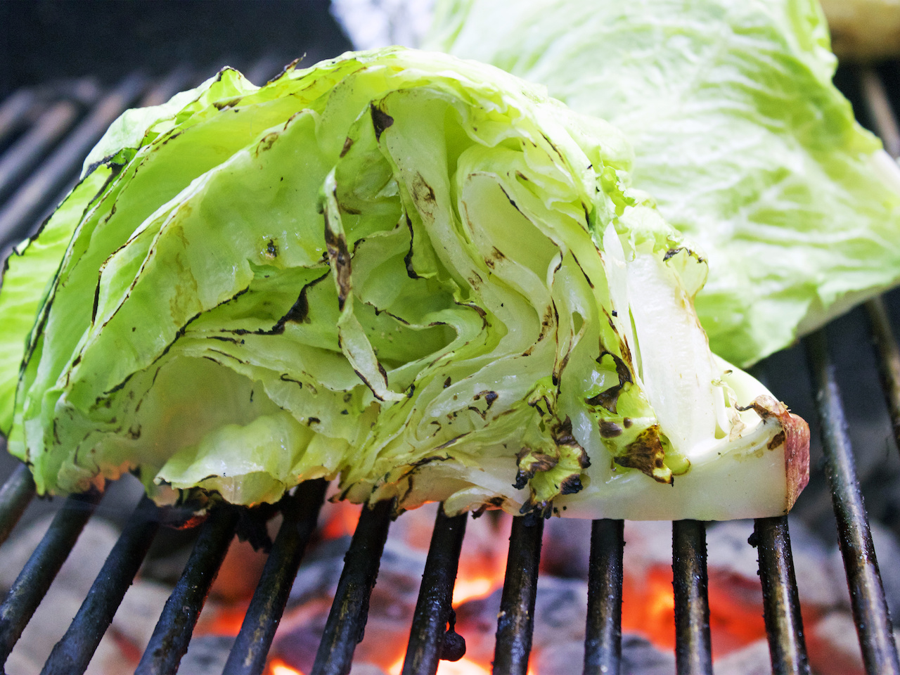 Grill iceberg, romaine or any other heads of lettuce for a depth of flavor. Grill the iceberg lettuce to enhance the flavor.