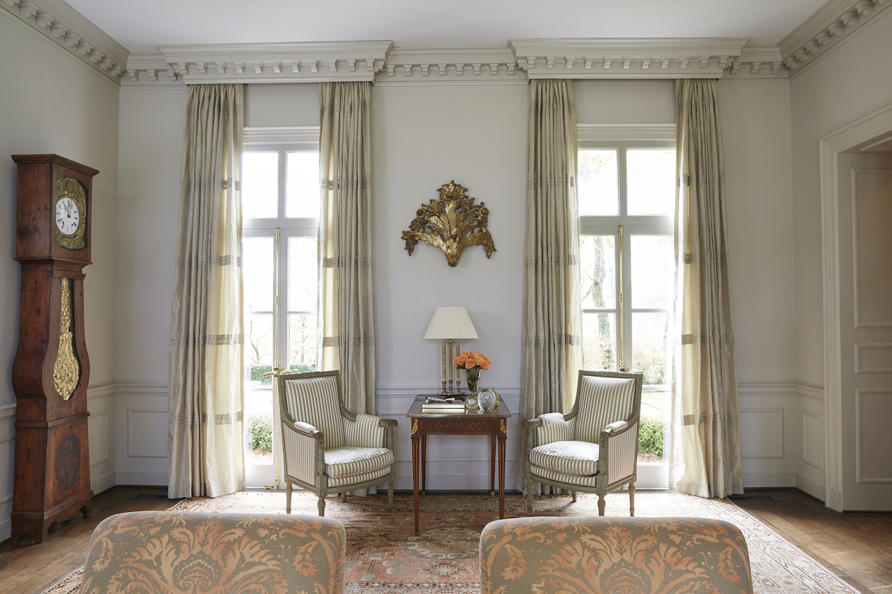 "I wanted to create a soft subtle weight in the room with the draperies. So I chose a silk that was just a little darker than the walls and created texture by adding the pleats down the panels," says Libby. "I wanted to create a soft subtle weight in the room with the draperies. So I chose a silk that was just a little darker than the walls and created texture by adding the pleats down the panels," says Libby.