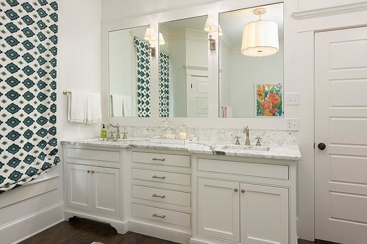 Besides the interesting pattern, the lighting fixtures are gorgeous in the master bath as well. colorful patterns in the bathroom