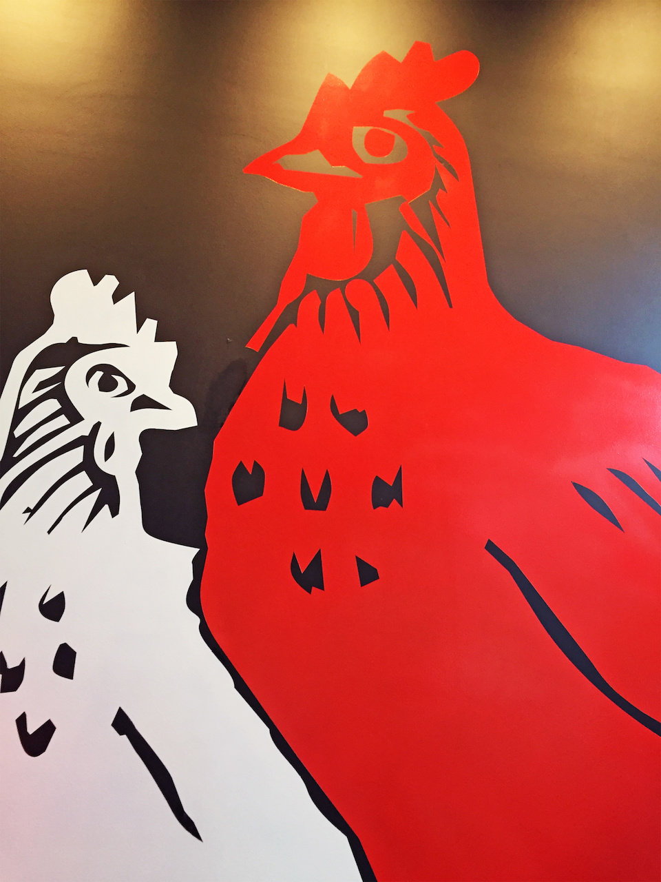 Two strapping chickens greet customers upon entrance into Hattie B's. Two strapping chickens greet customers upon entrance into Hattie B's.