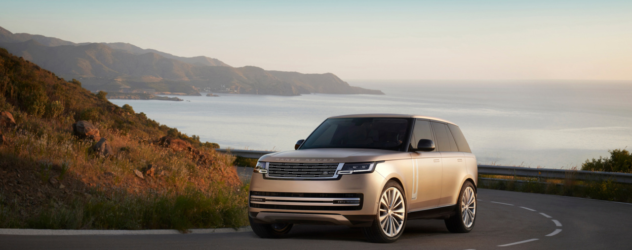 2026 Range Rover driving on coastal highway