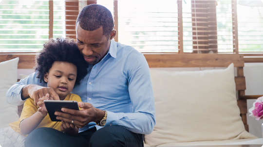 Father and son on tablet