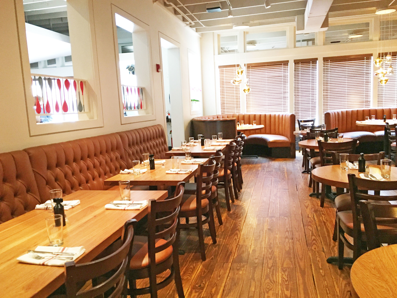 Those are wooden spoons dividing the room as a piece of art. sb-atlanta-morningside-colonnade-morningsidekitchen.jpg