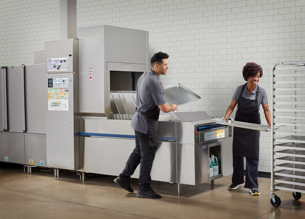 FT2000 Dishwasher Life-Style_UnloadPlatform w1Male1Female-SheetPans .png