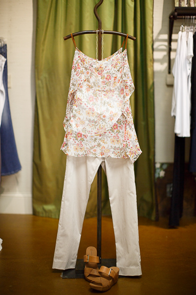 From Sorelle: Bailey|44 tiered floral top with braided leather straps, $206; Crazy Larry khaki fitted pants, $104 and Gold + Stone link necklace, $60 From Sorelle: Bailey|44 tiered floral top with braided leather straps, $206; Crazy Larry khaki fitted pants, $104 and Gold + Stone link necklace, $60