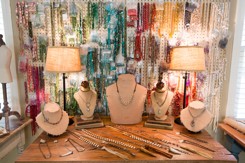 A pegboard filled with beads and other findings makes a colorful backdrop for a display of Amy's designs. A pegboard filled with beads and other findings makes a colorful backdrop for a display of Amy's designs.