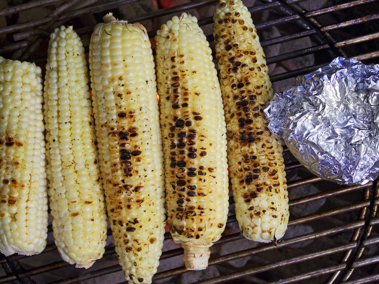 Grill your corn, either in the husk or without. Grill your corn, either in the husk or without.