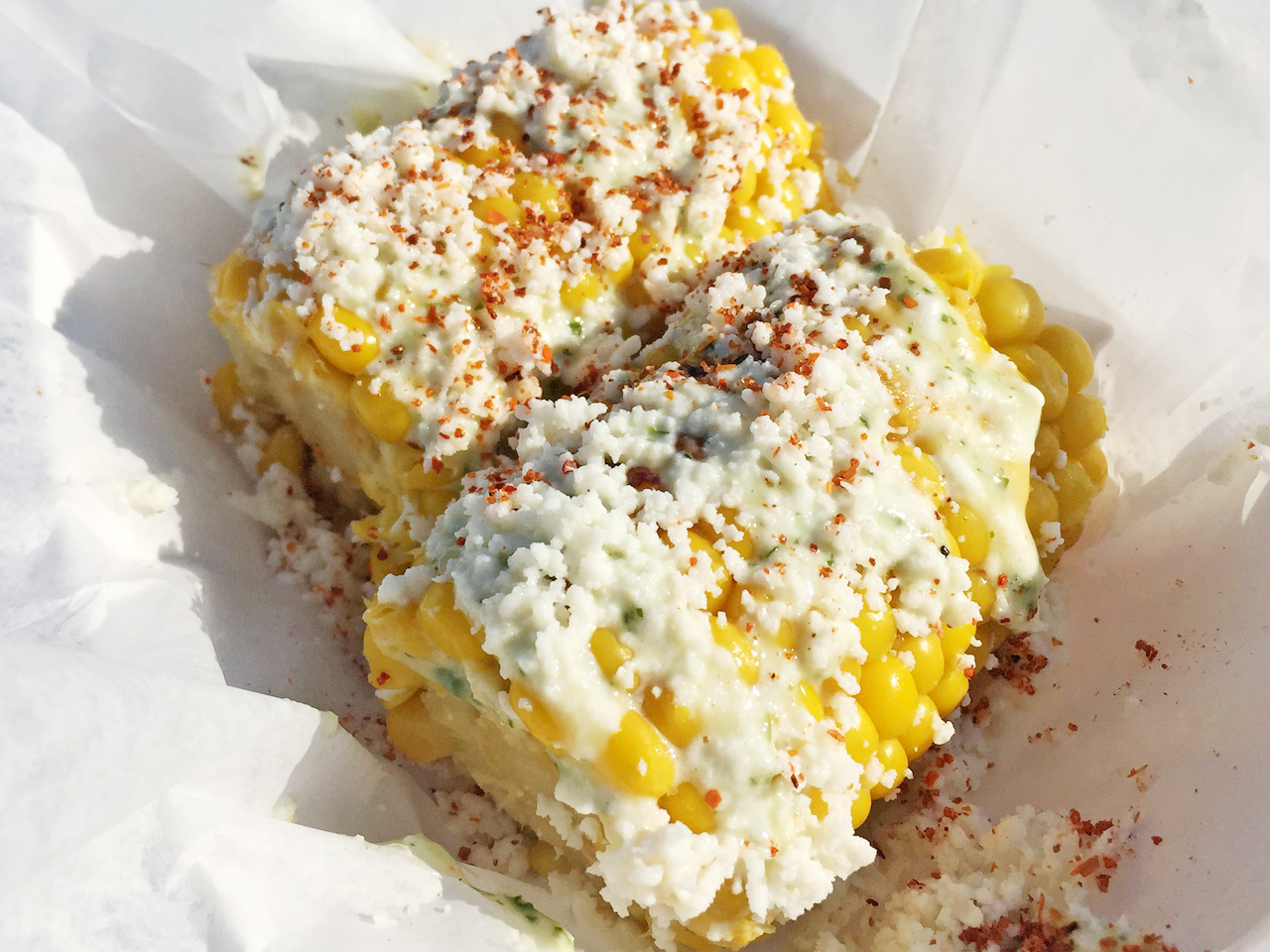 You must try the Mexican street corn, which is made-to-order grilled corn on the cob topped with cilantro mayo, cheese and spices. You must try the Mexican street corn, which is made-to-order grilled corn on the cob topped with cilantro mayo, cheese and spices.