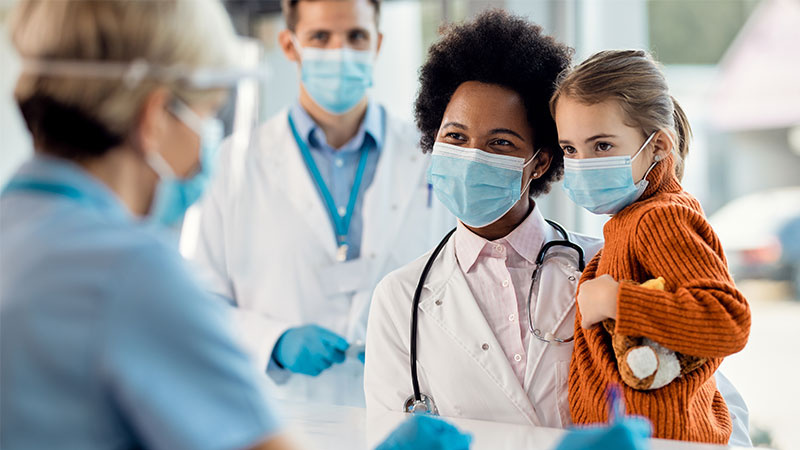 doctor holding child