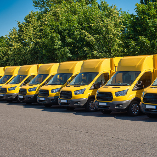 Yellow medium heavy duty vehicles parked