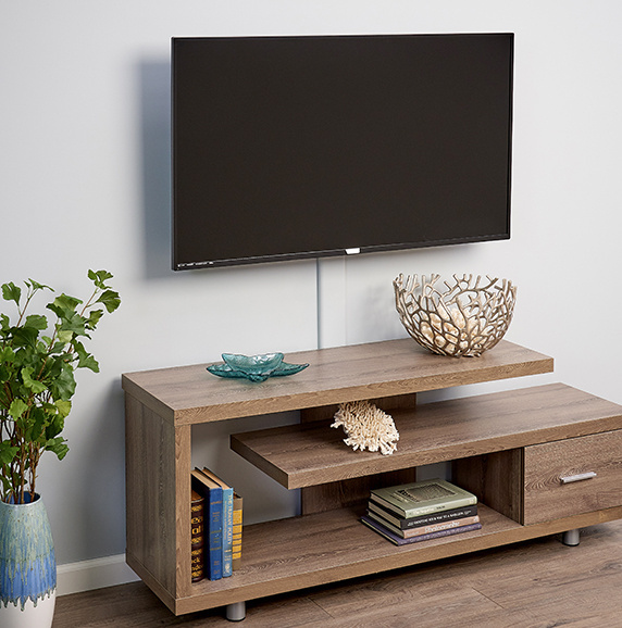 wooden entertainment center with wall mounted flat screen television above