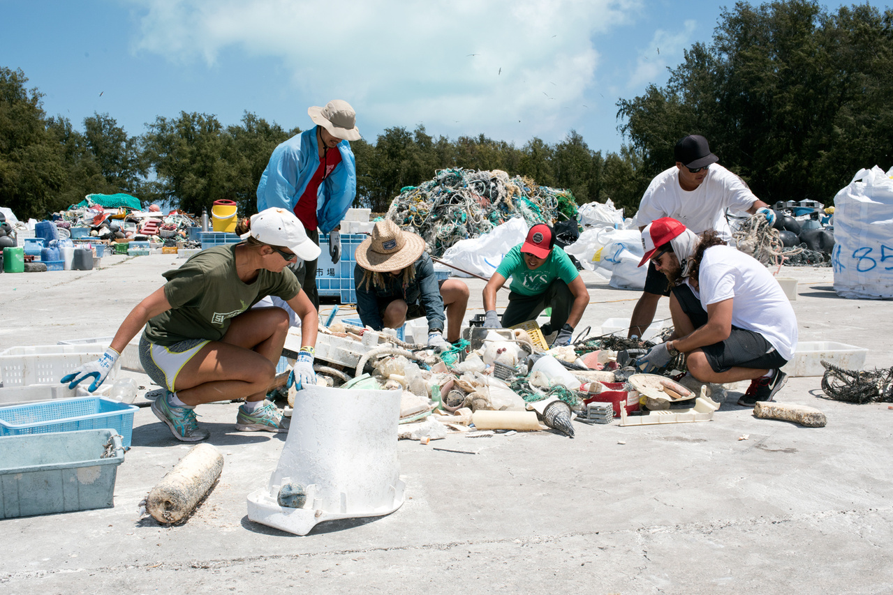 With the help of volunteers from the US Fish and Wildlife Service, the Marine Debris team has completed sorting the derelict fishing gear, plastics and other litter collected over the last eight operational days from the three islands of Midway Atoll National Wildlife Refuge. Photo: NOAA Fisheries/David Slater