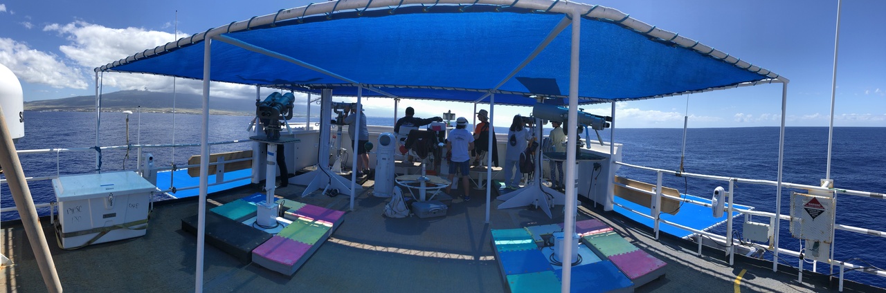 The marine mammal and seabird observers spend their days on the Sette's flying bridge from sunrise to sunset each day, searching for cetaceans and seabirds. Today, they are enjoying the beautiful weather conditions off the west side of the Big Island. Photo: NOAA Fisheries/Marie Hill.