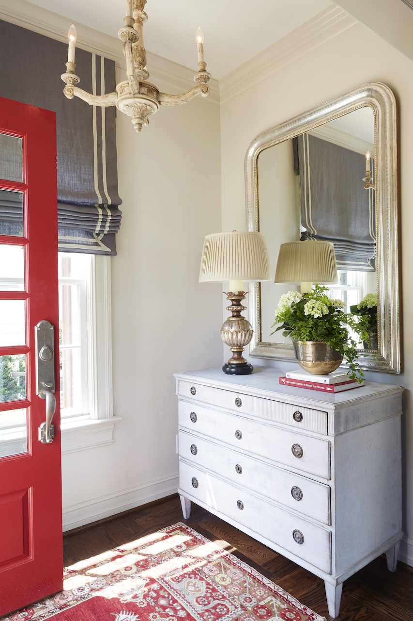 "It was important to keep the color theme in the crimson and gray as family and friends gather to tailgate for the Alabama games," says Libby of the "Game Day" house. "I wanted a calming overall neutral palette with pops of crimson!" "It was important to keep the color theme in the crimson and gray as family and friends gather to tailgate for the Alabama games," says Libby of the "Game Day" house. "I wanted a calming overall neutral palette with pops of crimson!"